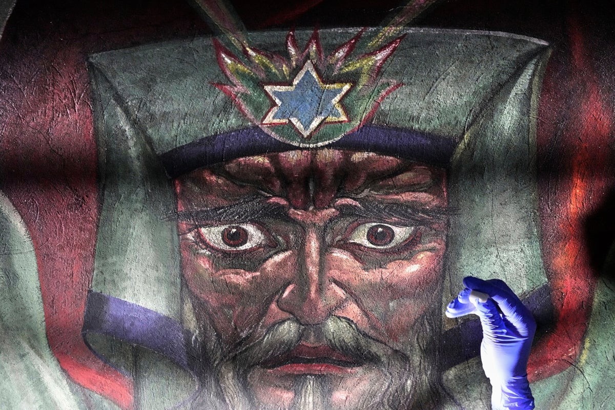 AP PHOTOS: Famed church murals featuring social commentary revived by conservationists