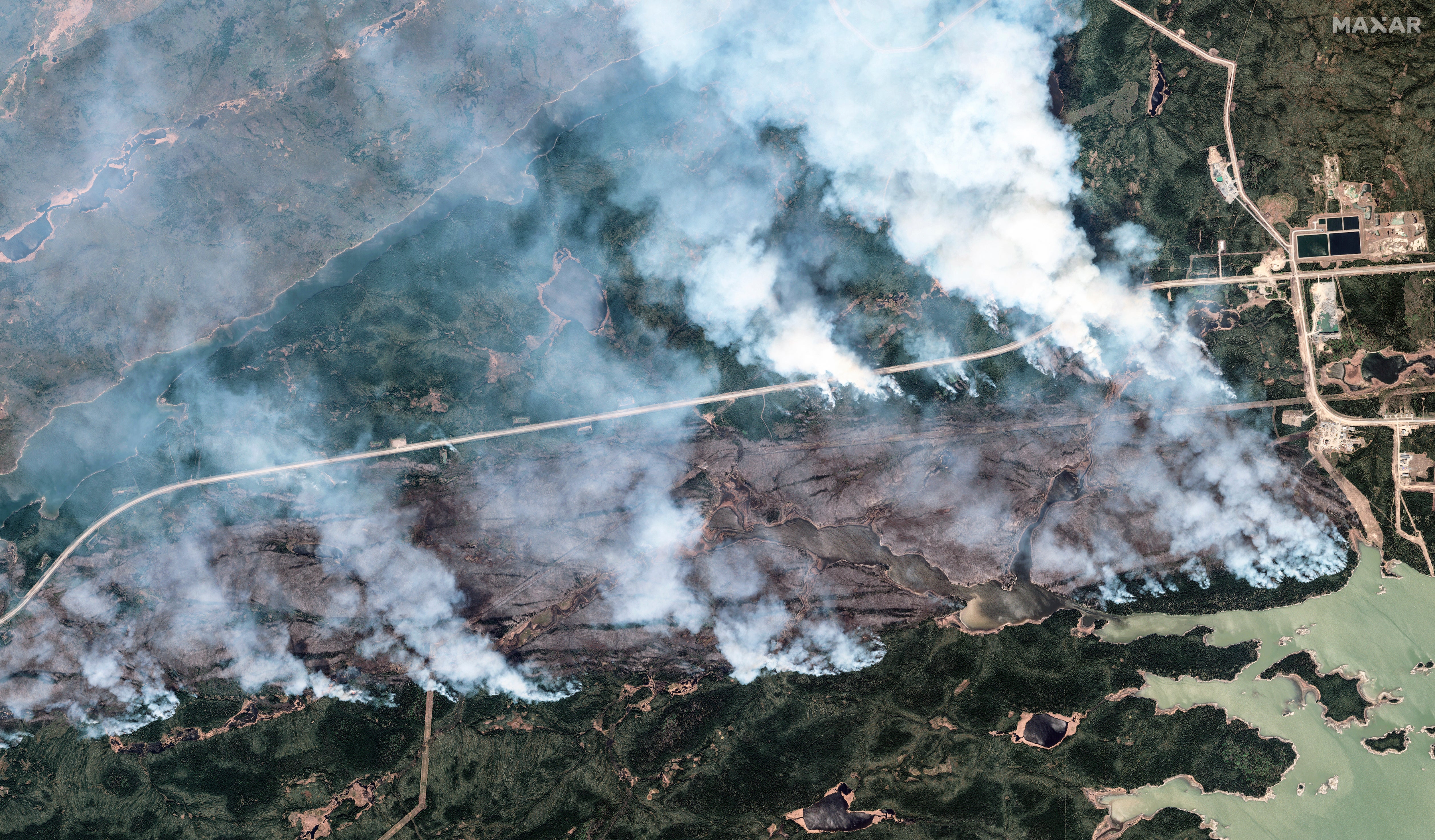 A satellite image provided by Maxar Technologies shows an overview of the York Factory First Nation Wildfire in Manitoba, Canada. There are more than 200 active wildfires burning there right now