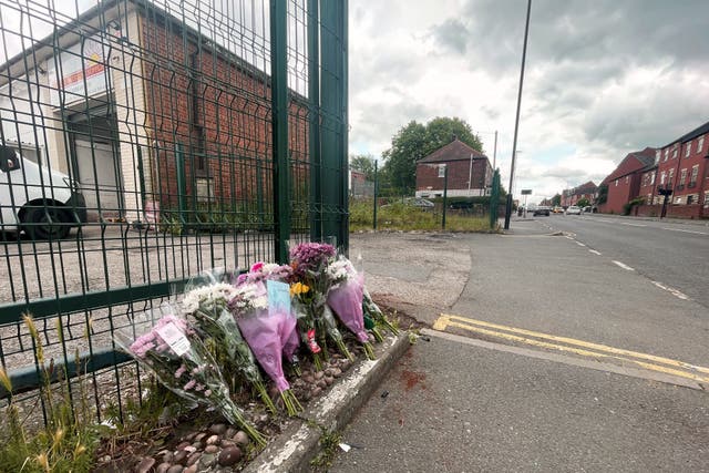 Flowers left at the scene in the Darnall area of Sheffield after a teenage pedestrian died in a collision involving an electric bike and a grey Audi (Dave Higgens/PA)