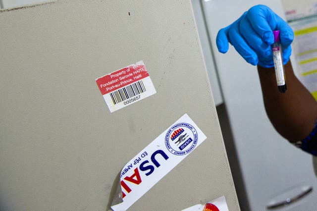 <p>A nurse performs an HIV test in Haiti. Several HIV prevention drugs and contraceptives purchased by USAID are set to be destroyed if they're not sold, according to a new report </p>