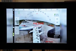 A TV screen shows a clip from the Ukraine's Operation ‘Spider's Web’ inside Russian territory during a news conference at the Ukrainian Embassy in Washington, DC