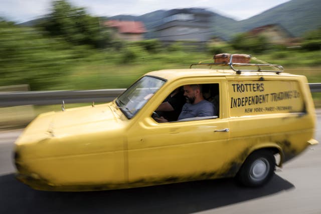 <p>Tarik Fatic along with his brother Mirnes drives the Reliant Regal, an exact copy of the famous BBC TV show ‘Only Fools and Horses’ iconic yellow car, in Sarajevo, Bosnia, on Wednesday, 4 June, 2025. (AP Photo/Armin Durgut)</p>
