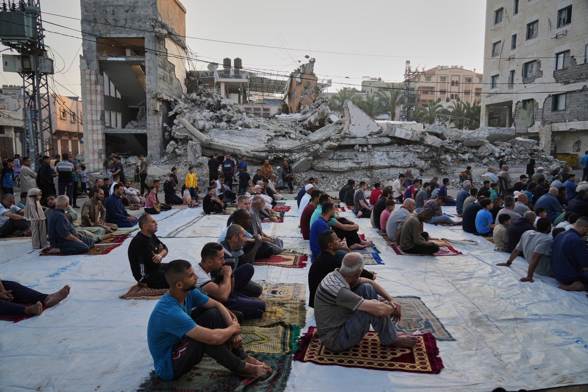 Gaza marks the start of Eid with outdoor prayers amongst the rubble and food growing ever scarcer