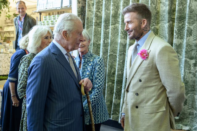 The King meets David Beckham during a visit to the RHS Chelsea Flower Show on May 19 (Paul Grover/Daily Telegraph) (PA)