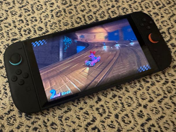Playing Mario Kart World on the Nintendo Switch 2. The character Birdo is in 2nd place