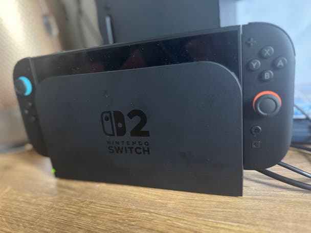 Nintendo Switch 2 in its dock on a desk
