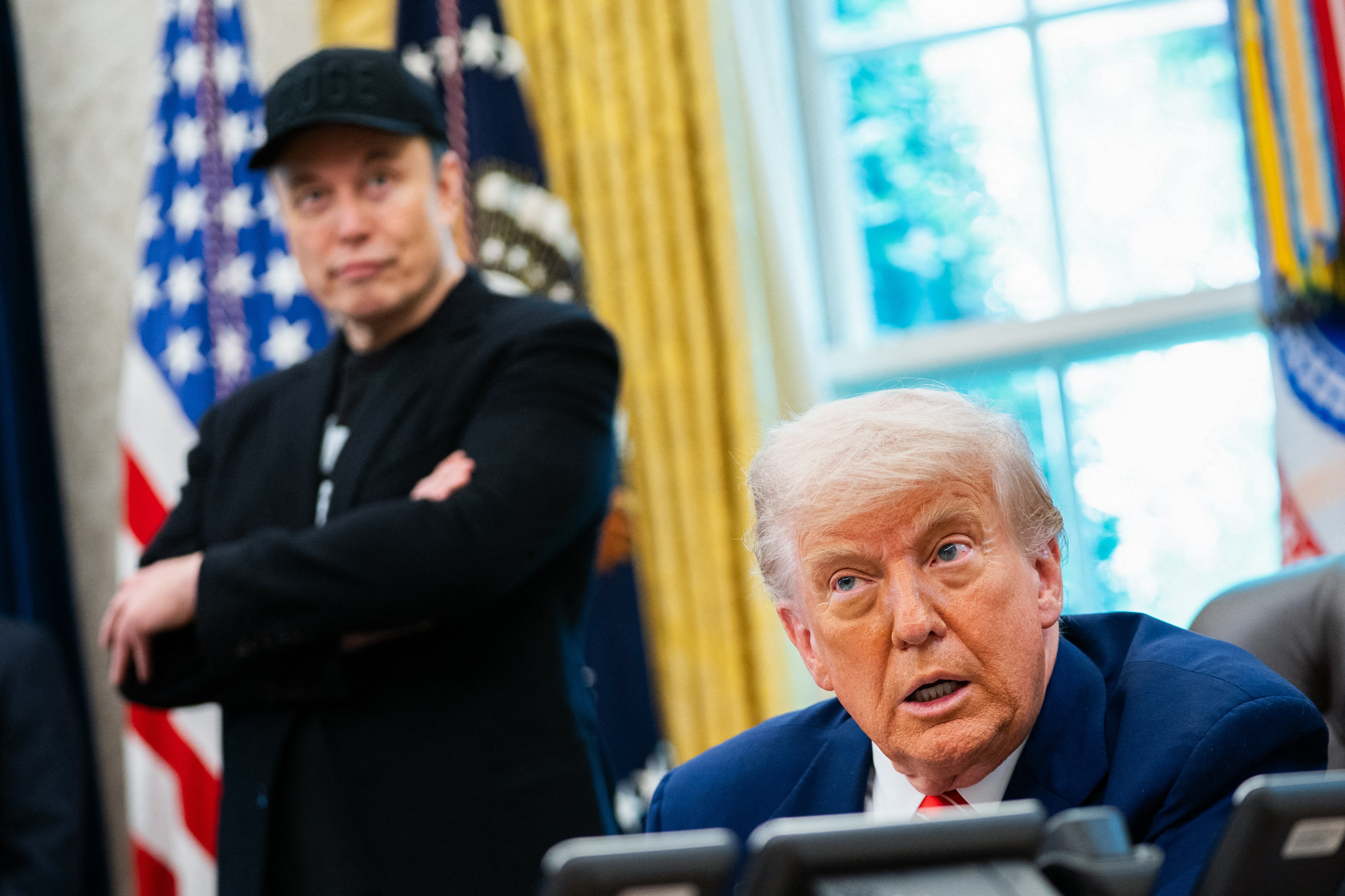 US President Donald Trump speaks during a news conference with Elon Musk (L) in the Oval Office of the White House in Washington, DC, on May 30, 2025