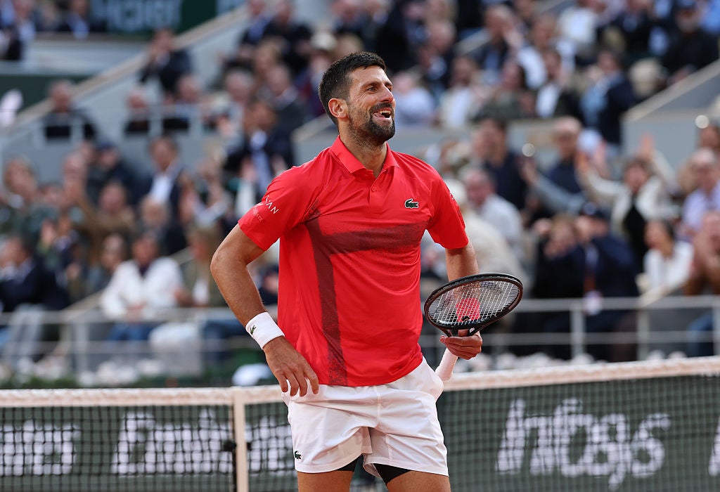 Djokovic laughs after winning an extraordinary rally against Sinner