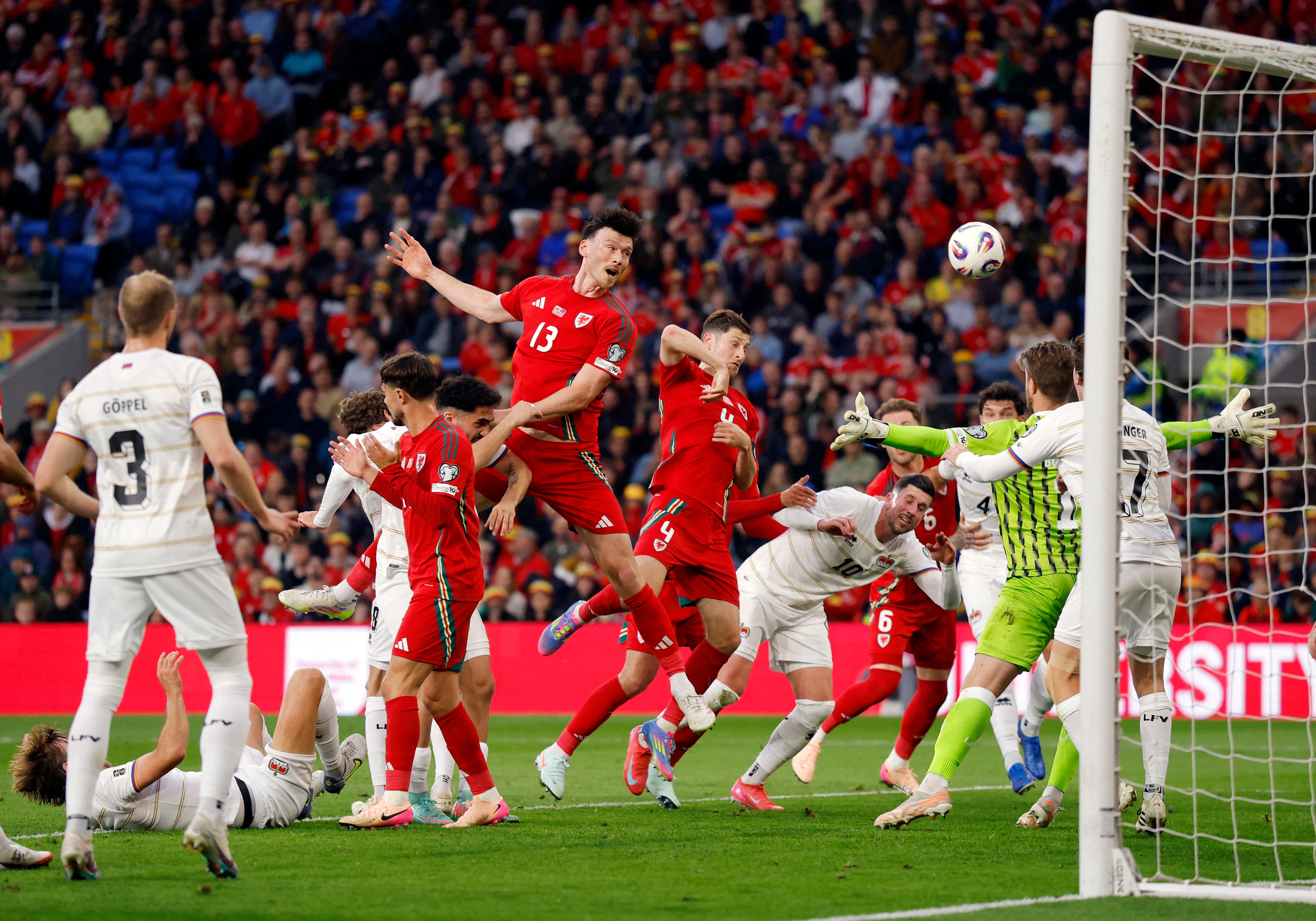 Kieffer Moore sends a headed effort at goal