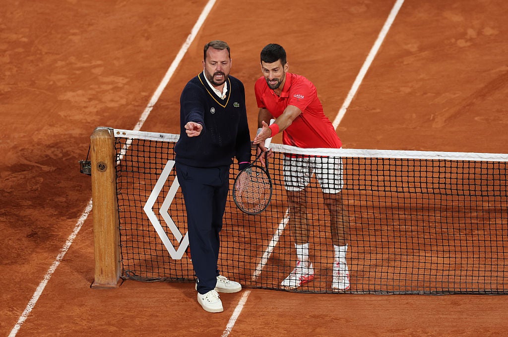 Djokovic contests a line call as he presses for the fourth set