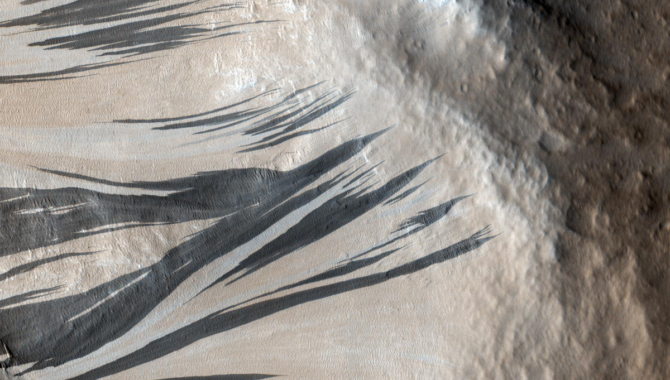 Eerie dark streaks seen on Mars likely formed differently than scientists thought. A new analysis using AI has shed light on that process