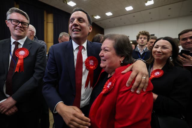 <p>Scottish Labour leader Anas Sarwar and deputy Jackie Ballie react after Davy Russell, Scottish Labour candidate, won the Hamilton, Larkhall and Stonehouse by-election on 6 June 2025 at South Lanarkshire Council Headquarters in Hamilton, Scotland</p>