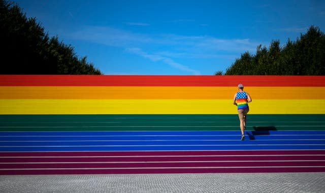 <p>A staircase covered by a rainbow flag at Four Freedoms Park in New York City in June 2019 — the largest such flag in the city, according to organizers.</p>