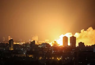 Fire and smoke rise in Kyiv after a Russian drone strike overnight