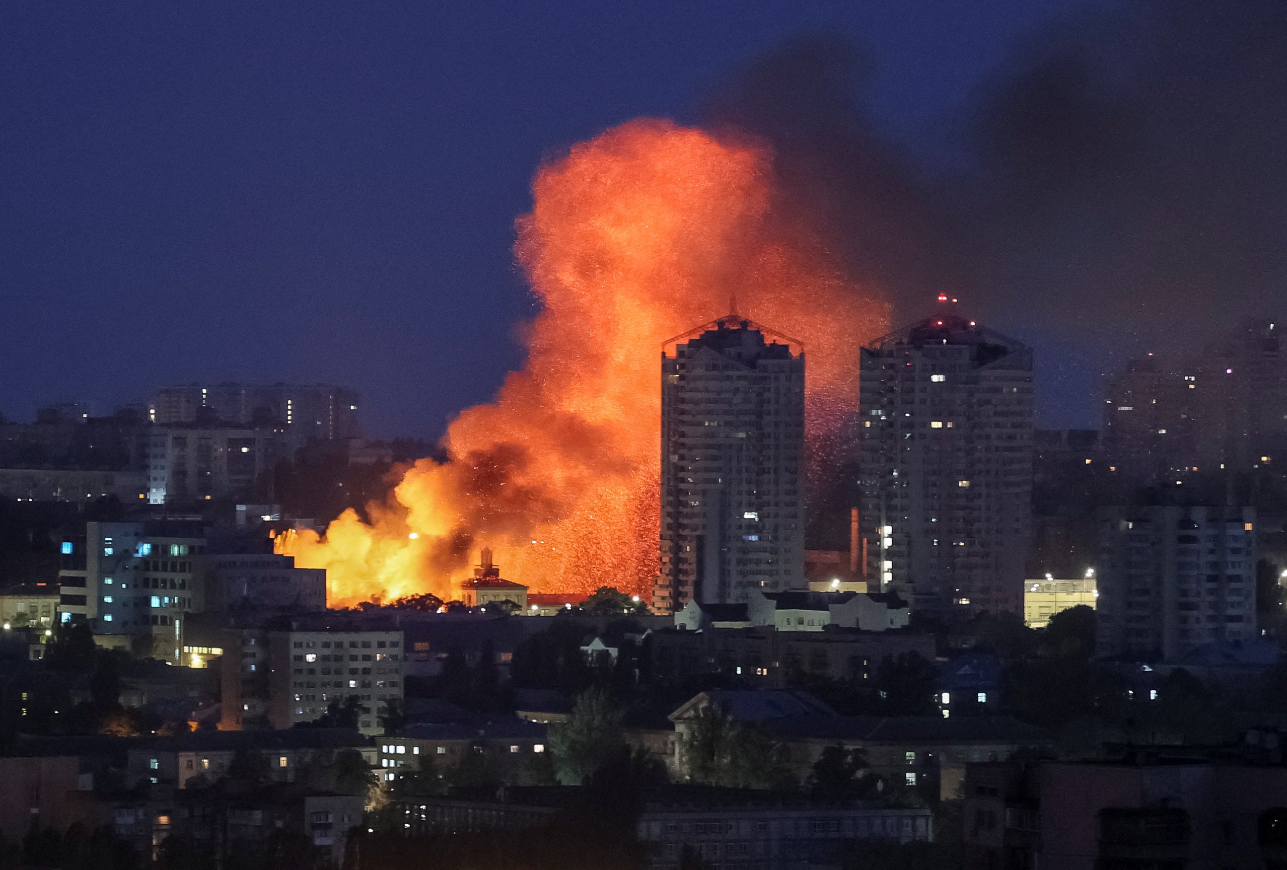 Fire and smoke rise in the aftermath of a Russian drone strike on Kyiv