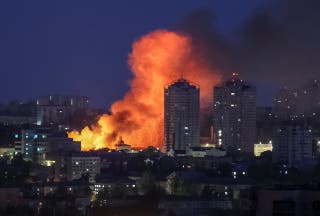 Fire and smoke rise in the aftermath of a Russian drone strike on Kyiv