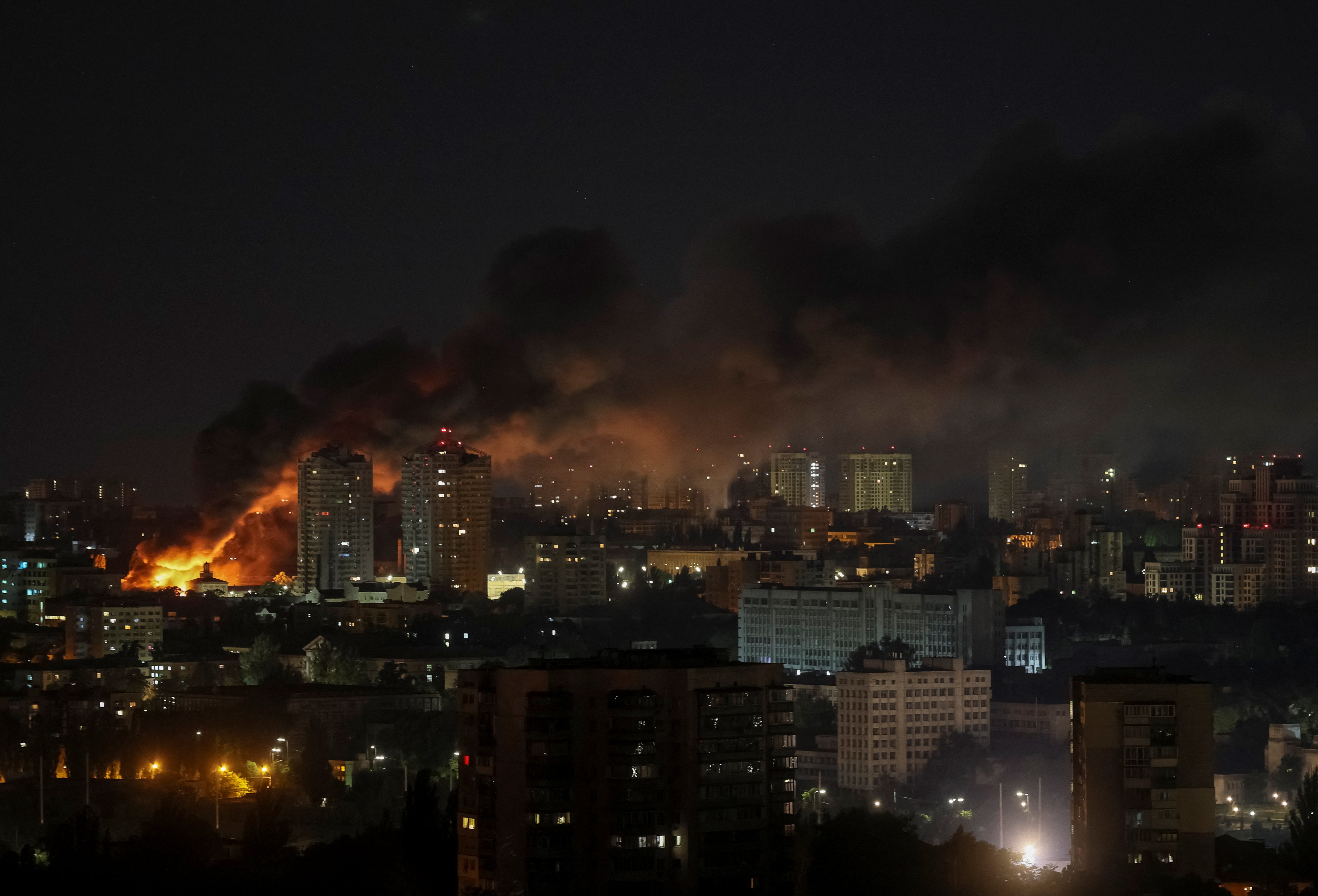 Fire and smoke rise after a Russian drone strike on Kyiv