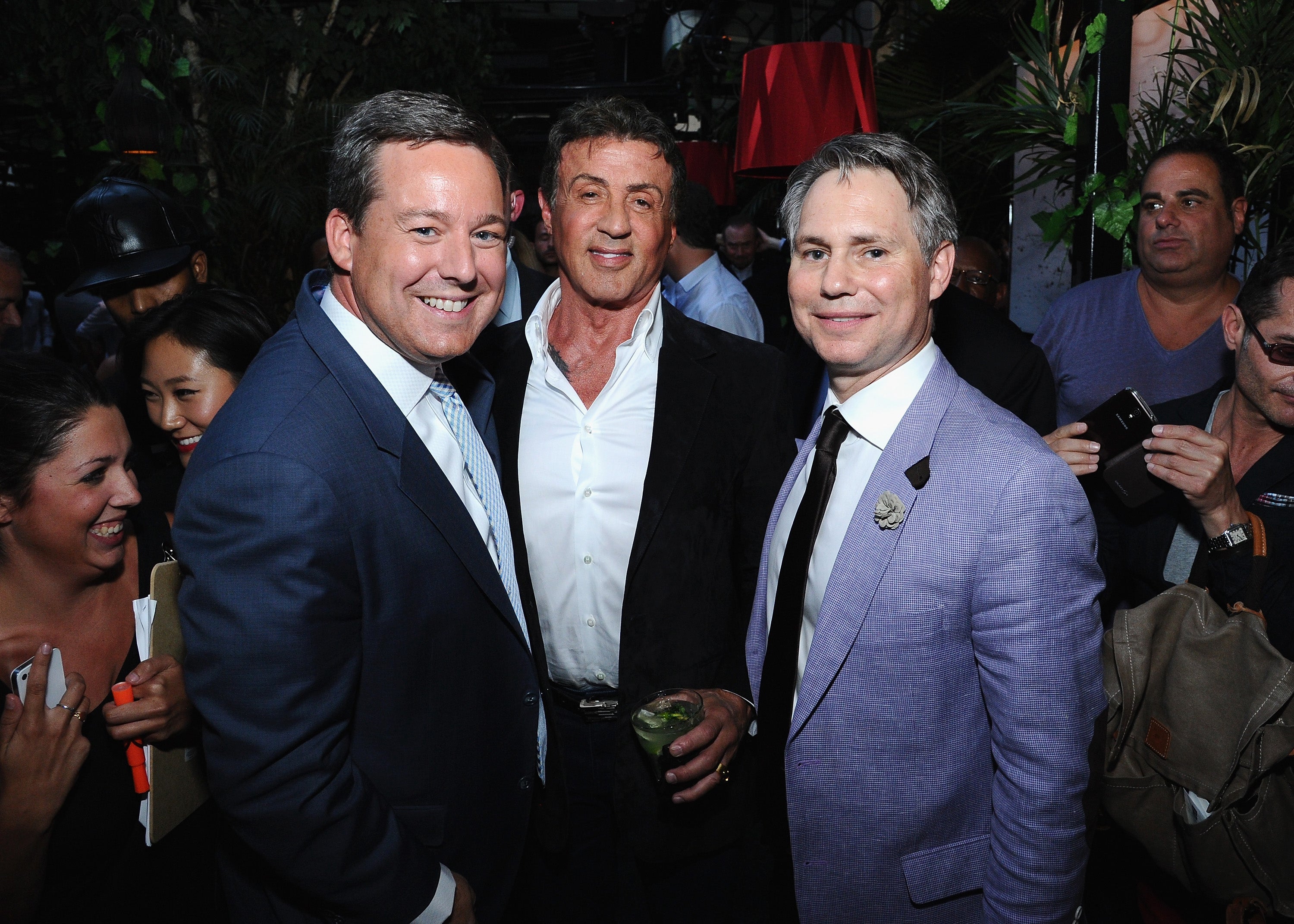 Henry, seen here with actor Sylvester Stallone, was the center of a human resources complaint while he worked for fringe right-wing outlet Real America’s Voice