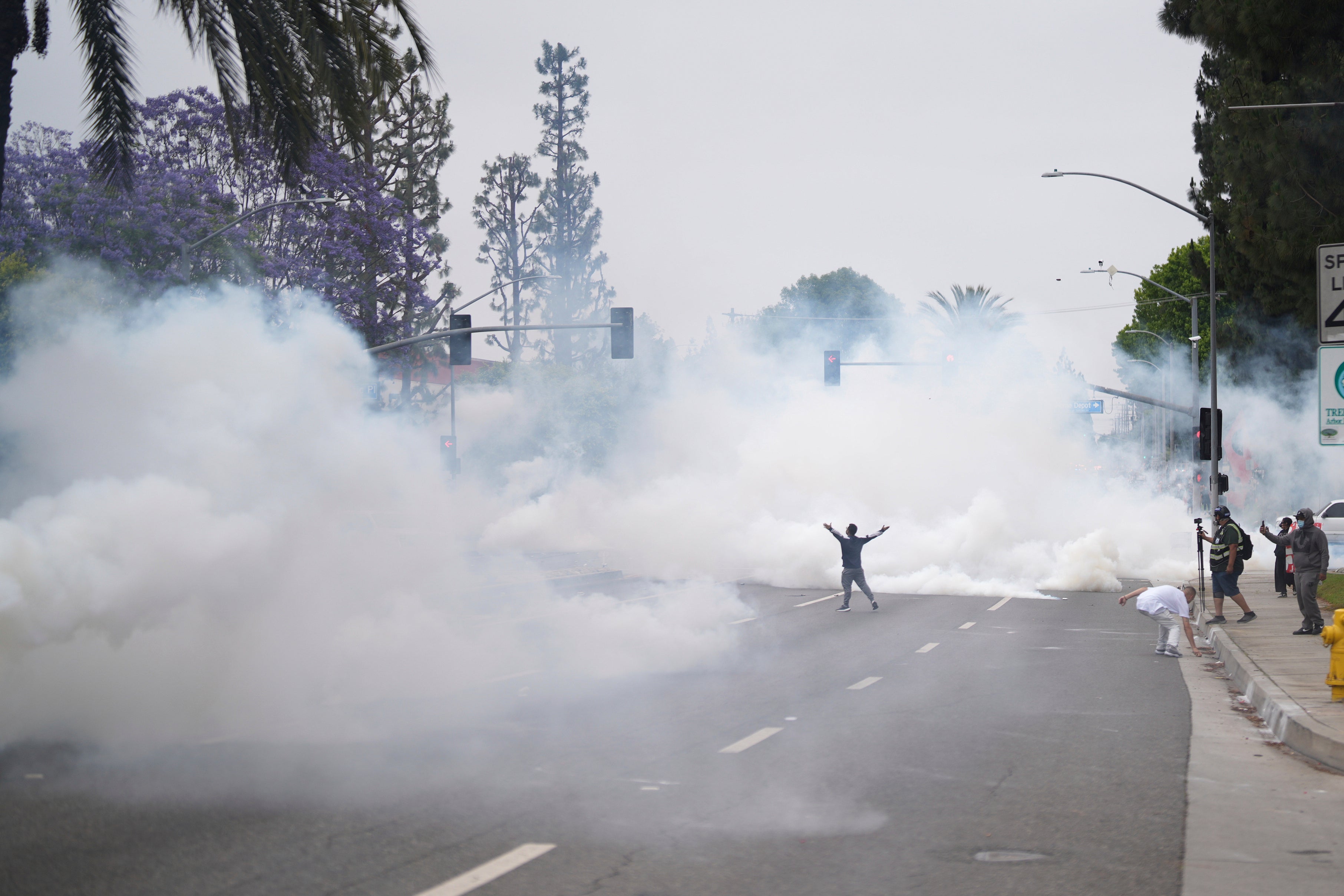 Smoke fills streets as protesters face law enforcement