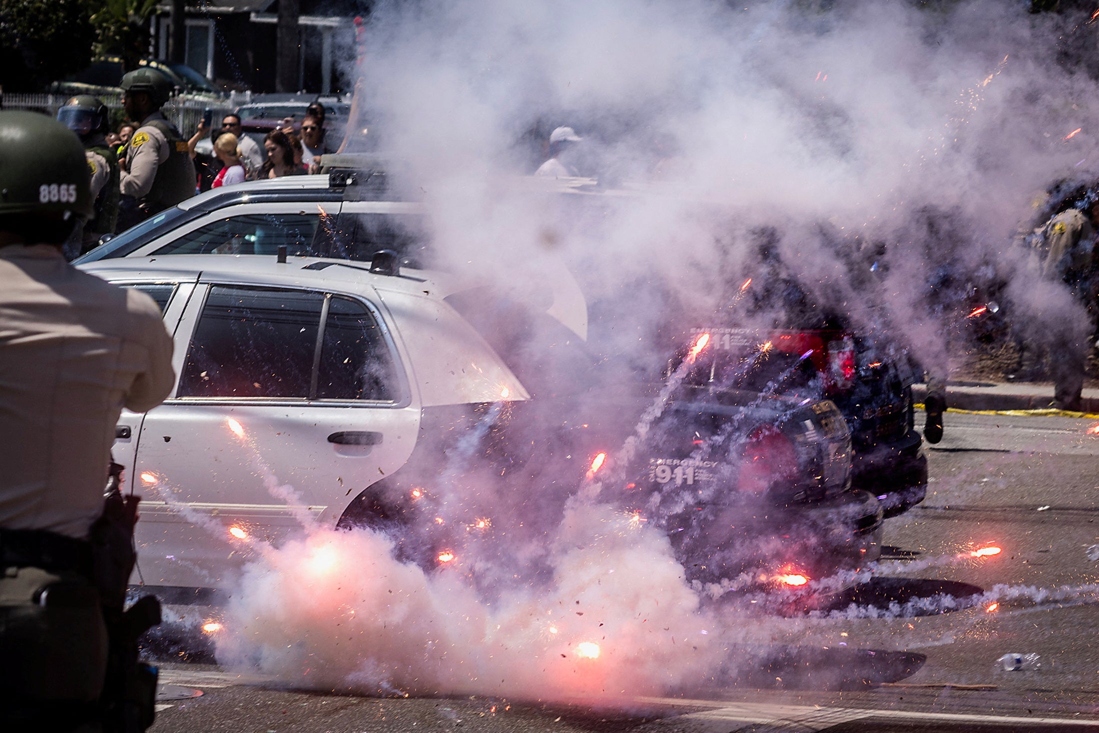 A firework explodes after being thrown at police during a standoff with protesters following multiple detentions by Immigration and Customs Enforcement (ICE), in the Los Angeles County city of Paramount, California, U.S., June 7, 2025