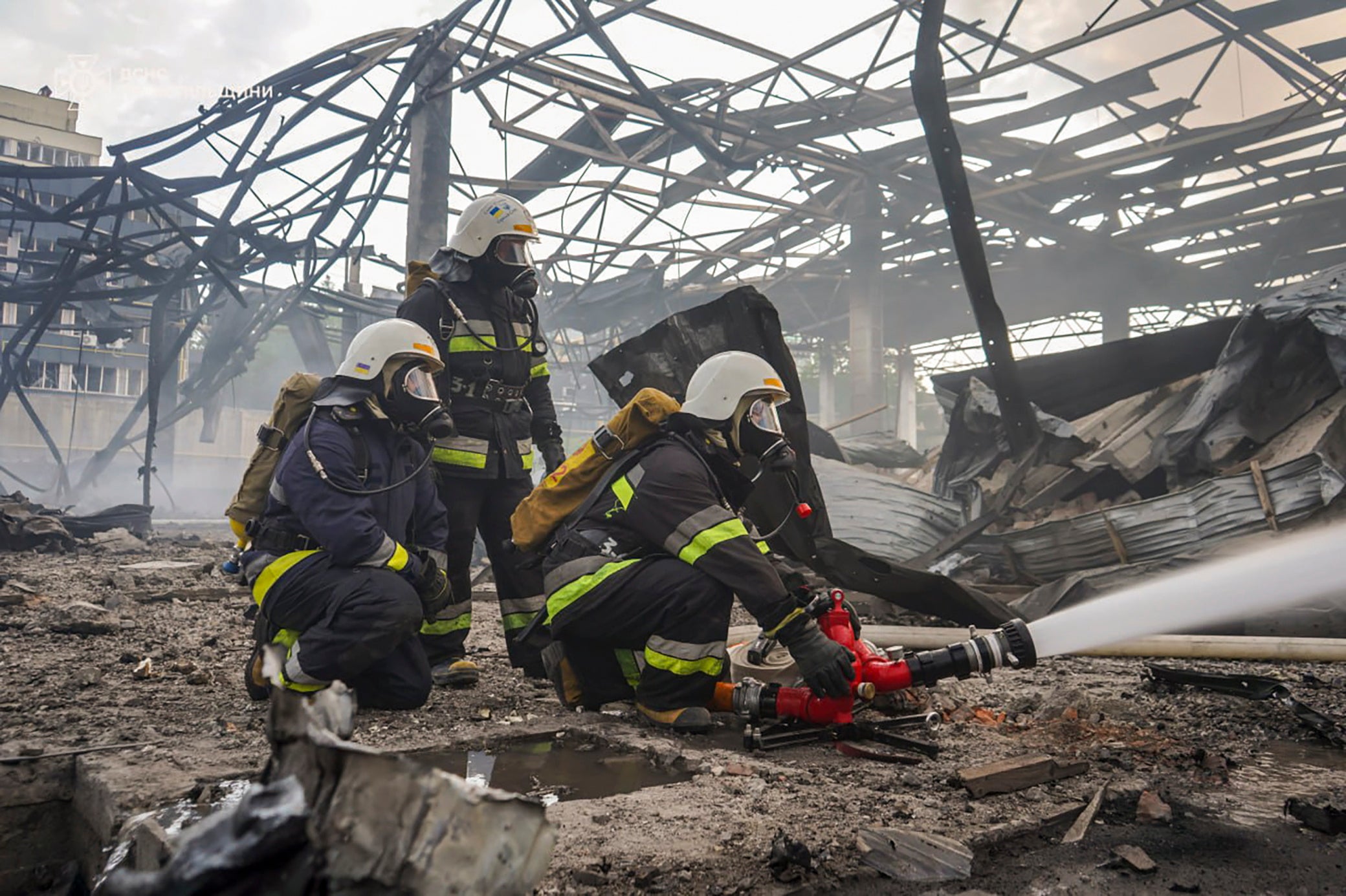 Handout photo made available by the State Emergency Service of Ukraine shows rescuers working at the site of an industrial facility hit by an overnight strike in Ternopil, Ukraine