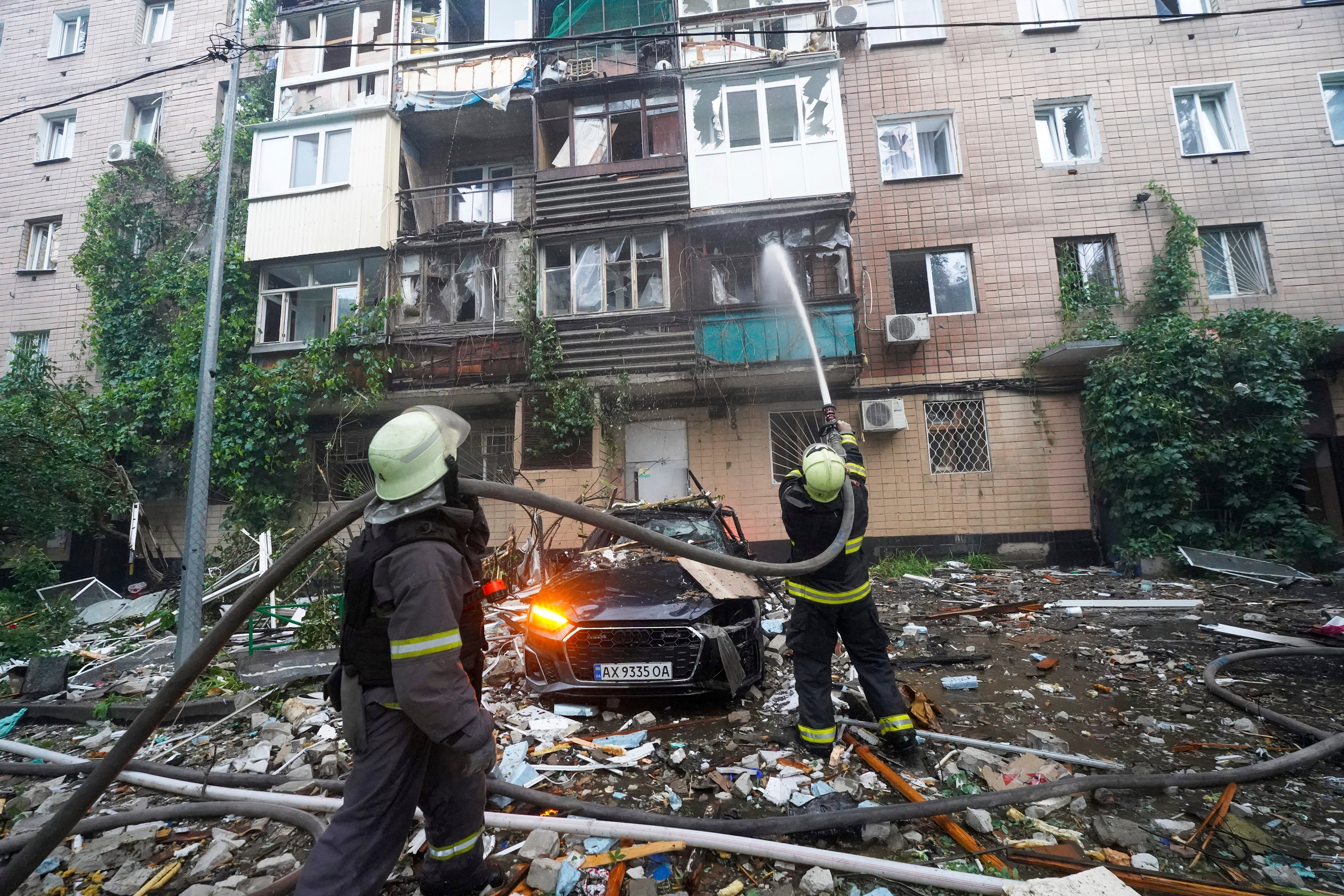 Firefighters tackle a blaze after a Russian attack