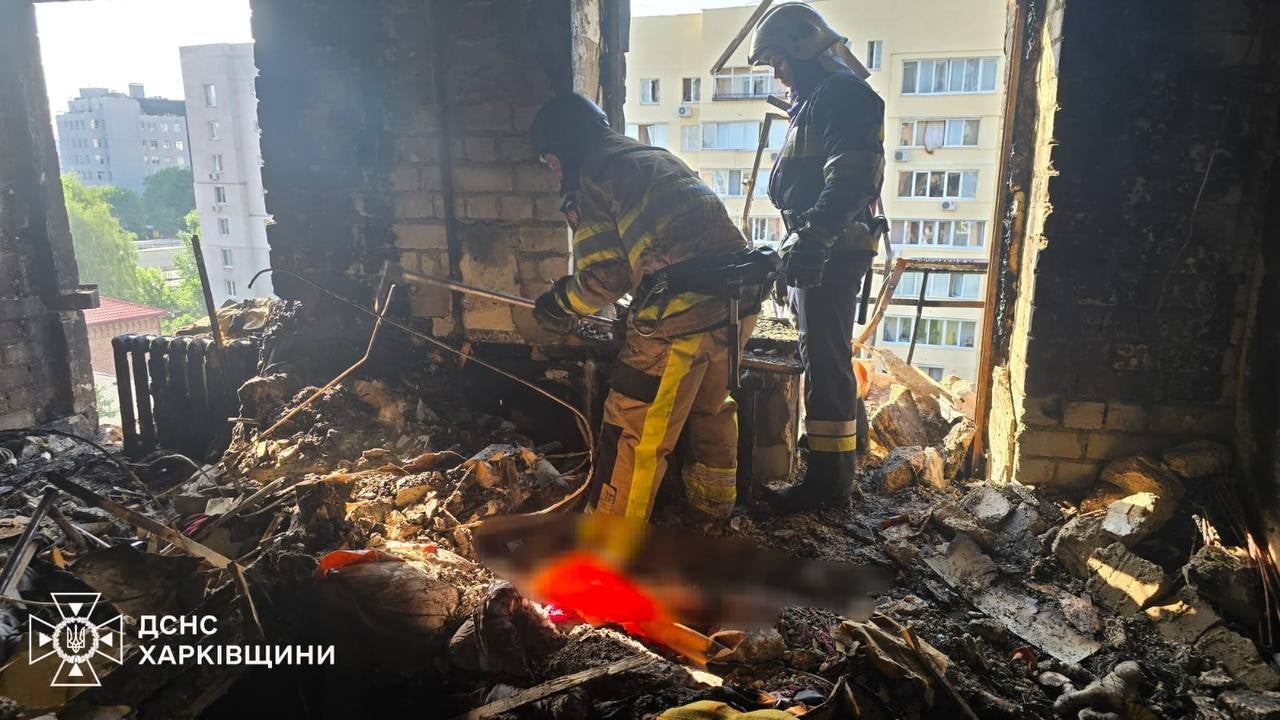 Rescuers working at the site of an airstrike in Kharkiv,