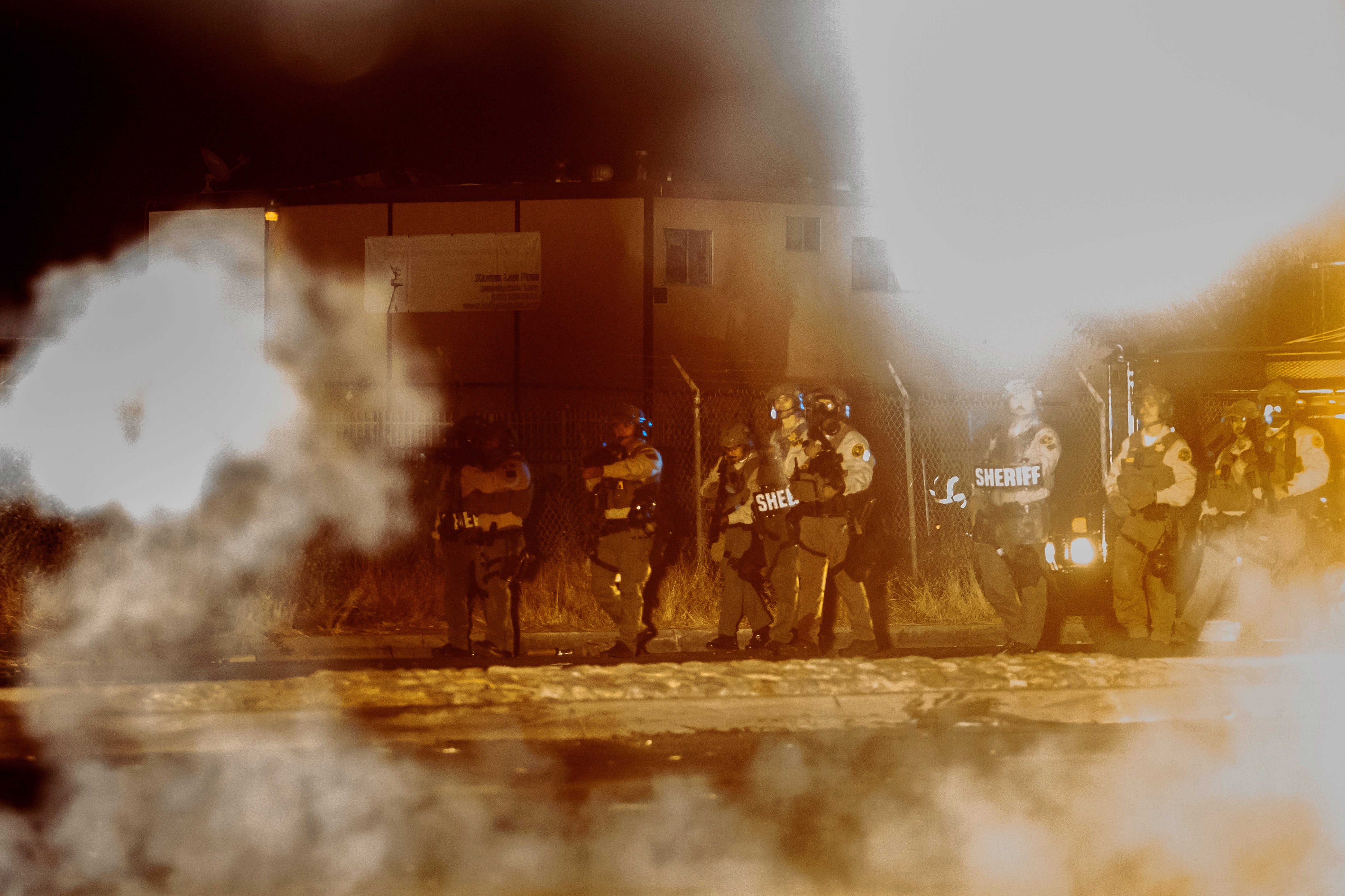 Los Angeles Sheriff Department deputies face off against protesters