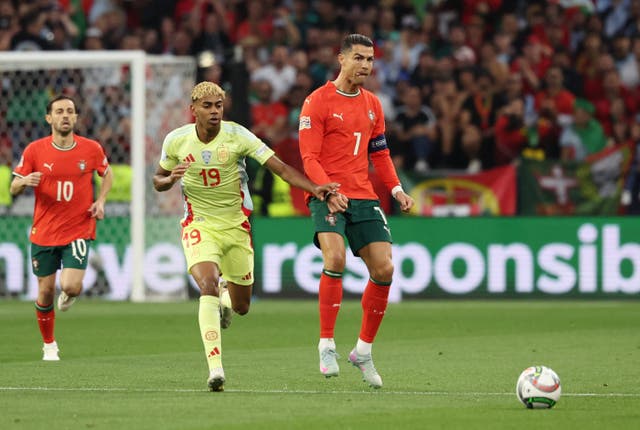 <p>Cristiano Ronaldo (right) has urged people to be patient with Lamine Yamal</p>