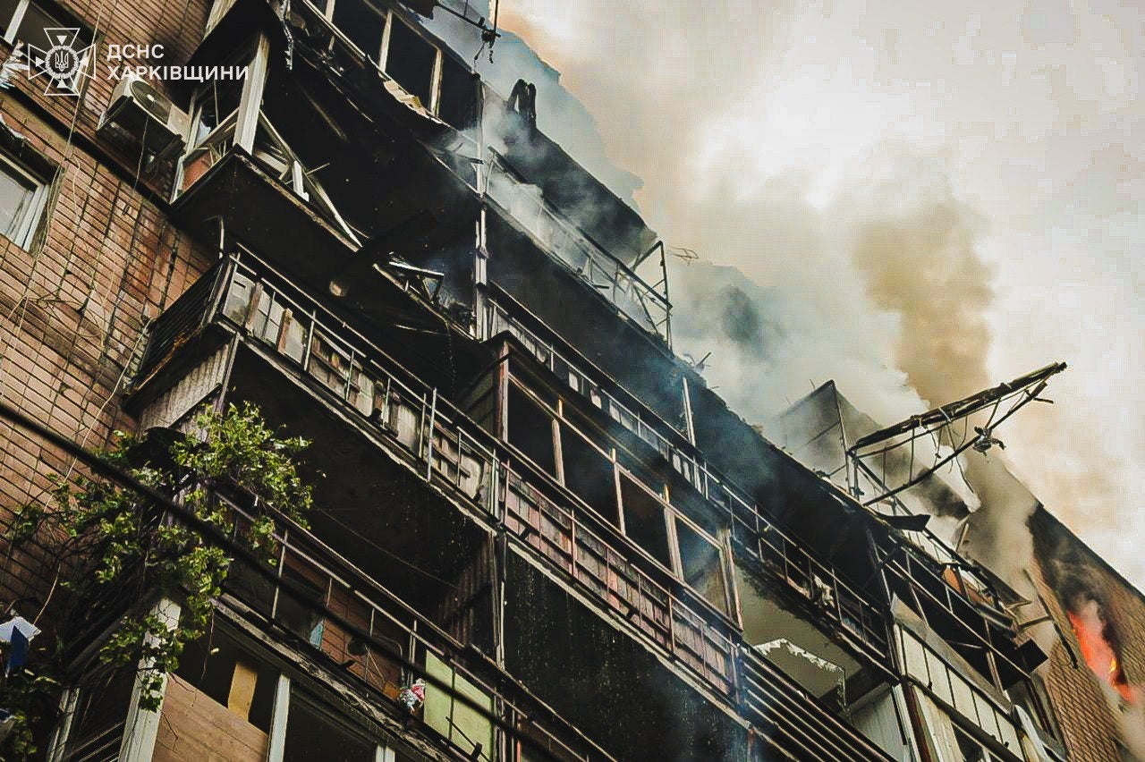 A handout photo released by the press service of the State Emergency Service (SES) of Ukraine shows smoke billowing from a fire burning in a building after an airstrike in Kharkiv,