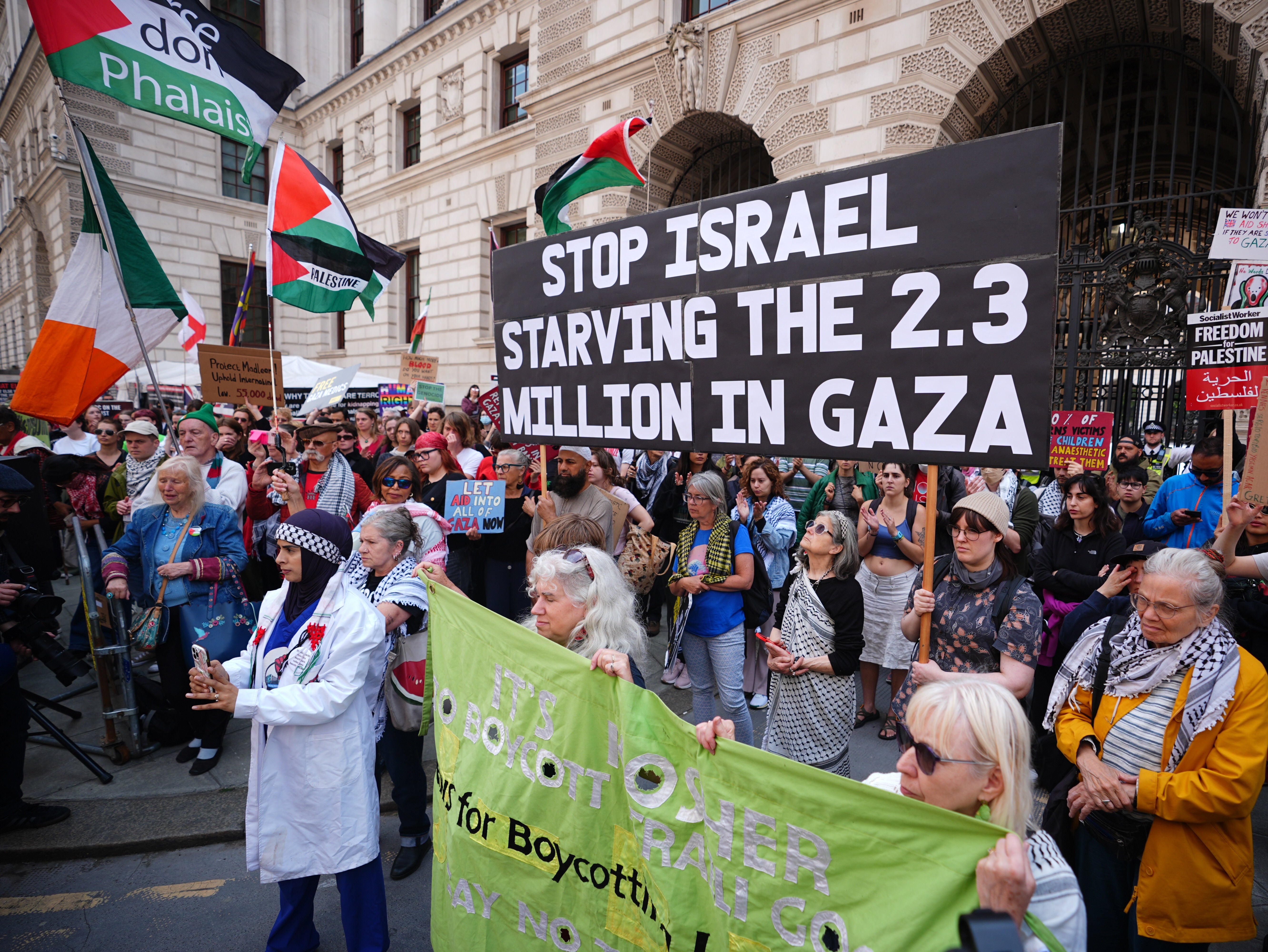 Protesters take part in a demonstration outside the Foreign, Office in London, calling for the UK government to protect the crew of Madleen