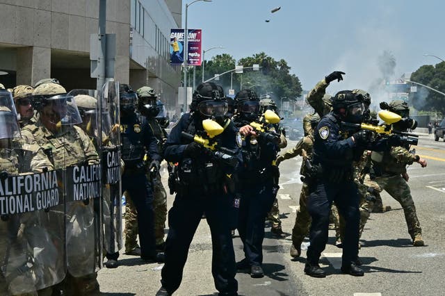 <p>National Guard soldiers and US Department of Homeland Security officers clash with demonstrators outside the Metropolitan Detention Center in downtown Los Angeles</p>