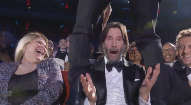 <p>Keanu Reeves is straddled by Jonathan Groff at the 2025 Tony Awards</p>