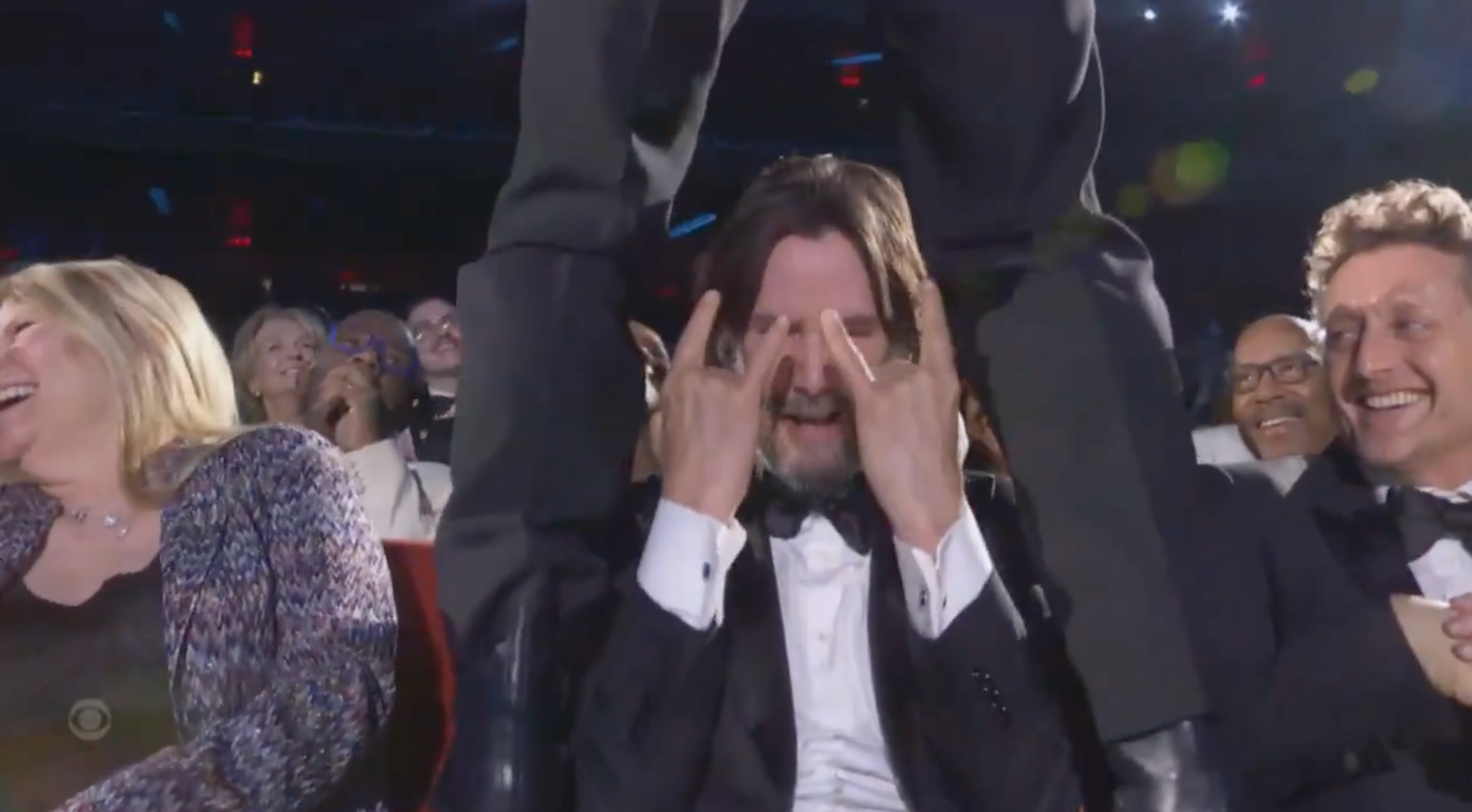 Keanu Reeves gives his approval after being straddled by Jonathan Groff at the 2025 Tony Awards