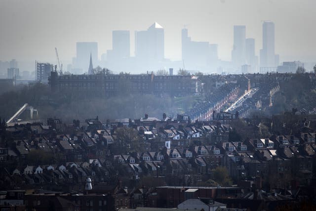 The Canary Wharf skyline viewed through the haze from Alexandra Palace (Victoria Jones/PA)
