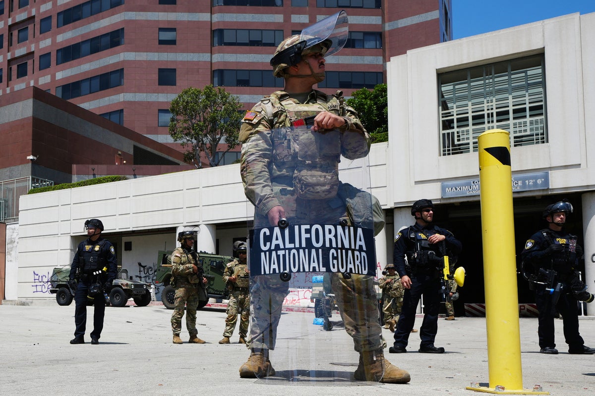 Curfew enforced in parts of Downtown, Trump claims ‘paid agitators’ targeted LA police with bricks