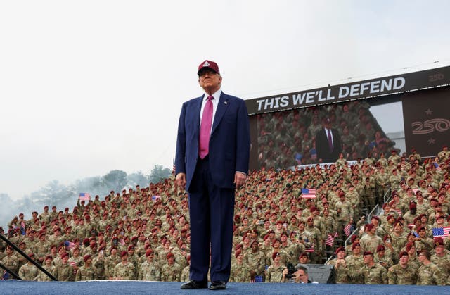 <p>U.S. President Donald Trump stands onstage to deliver remarks during a visit to Fort Bragg to mark the U.S. Army anniversary, in North Carolina, U.S., June 10, 2025</p>