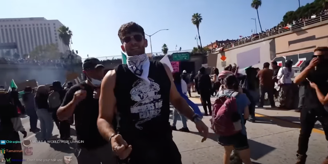 <p>Hasan Piker appears disoriented as flashbangs go off in LA riots </p>