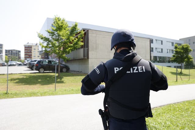 <p>A police officer near the school where the shooting occurred</p>