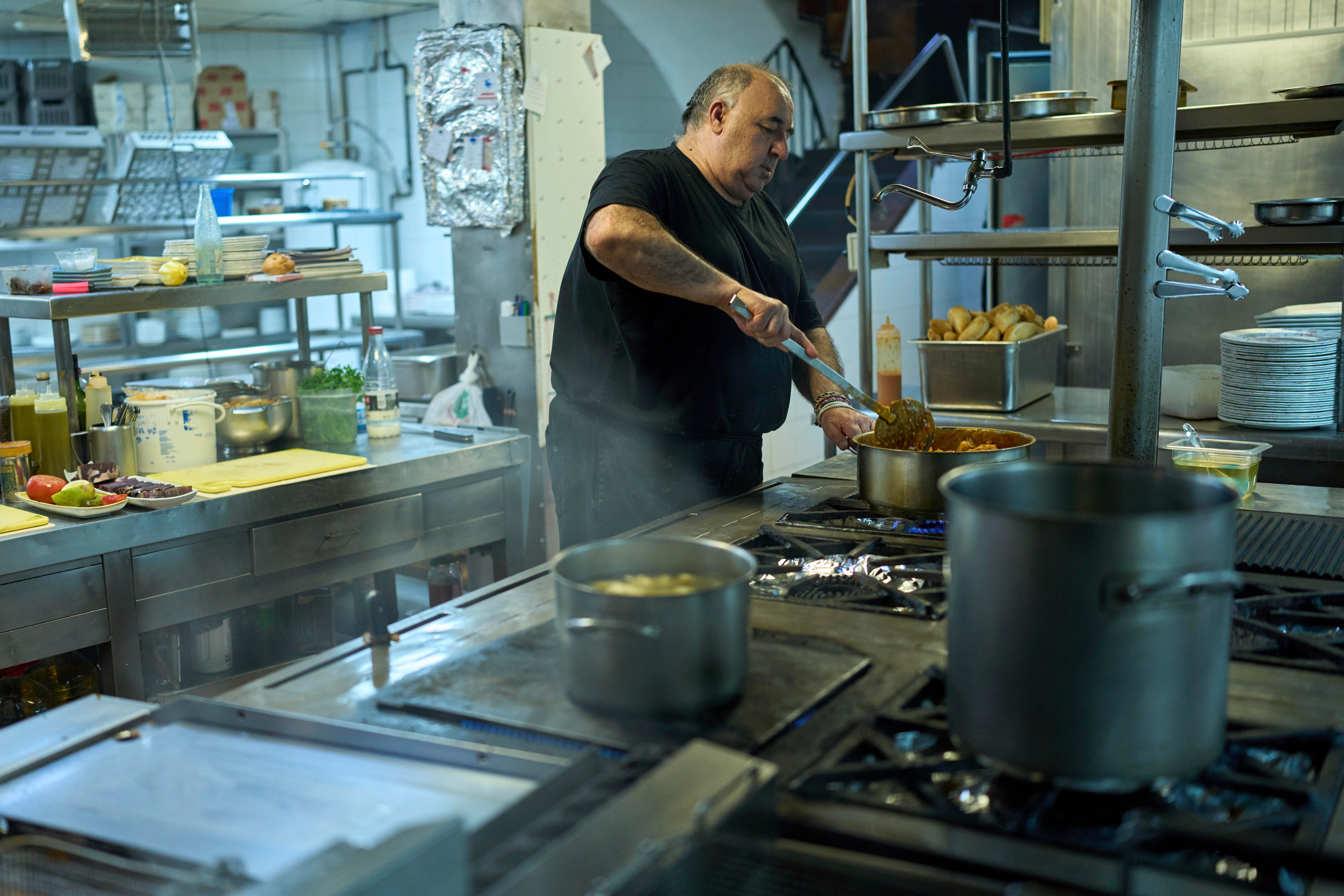 A chef cooks at Casa Pedro restaurant in Madrid