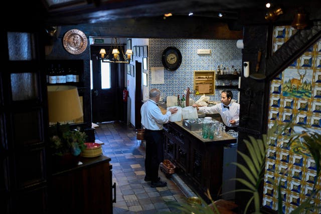 <p>Waiters work at Casa Pedro restaurant in Madrid</p>