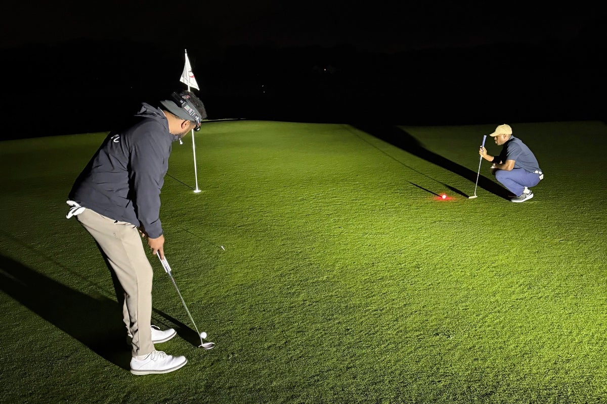 Flashlights and glowing golf balls. How a NY man played for 35 hours in quest for world record