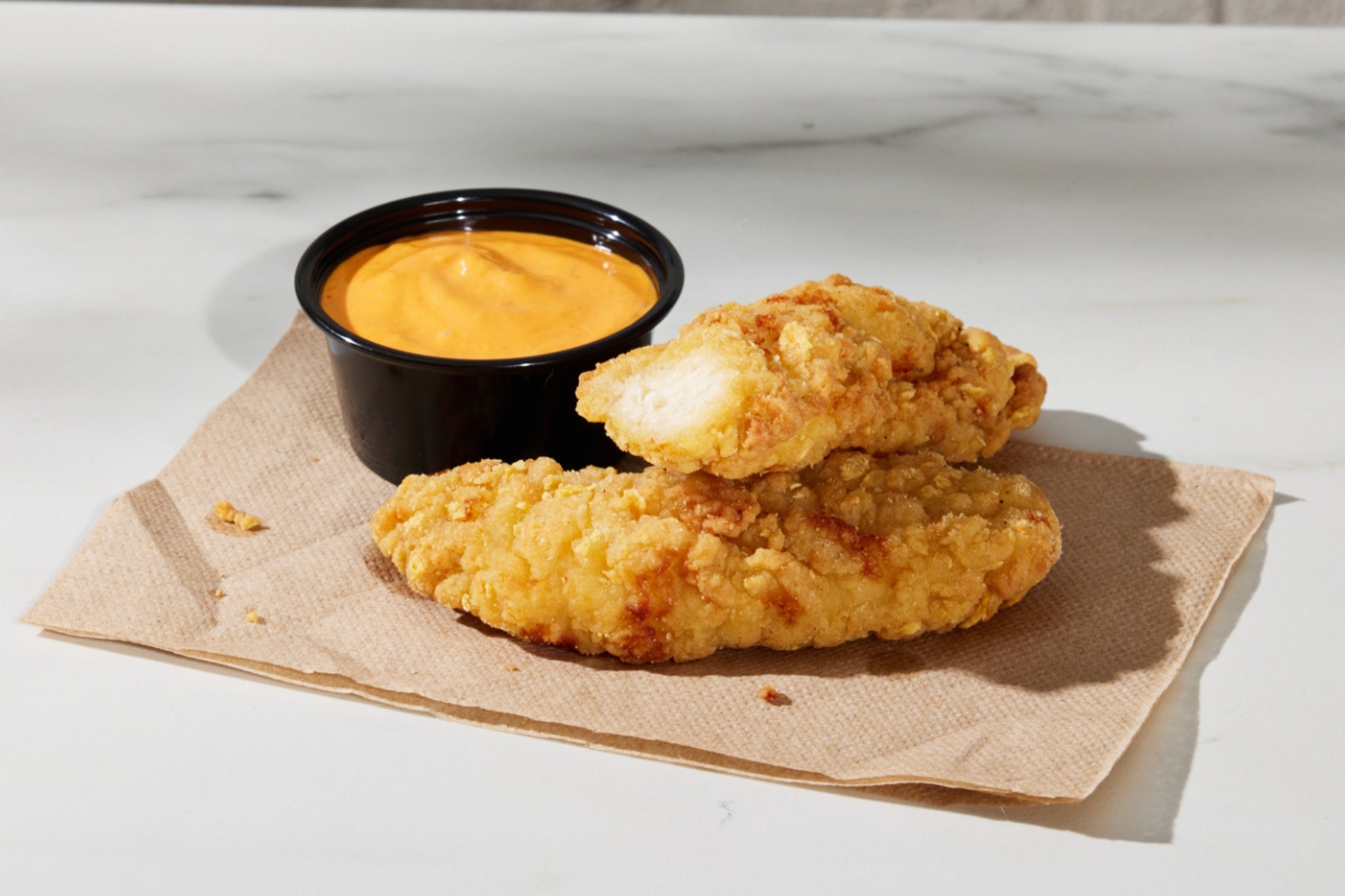 The new chicken strips will cost $3.99 for two