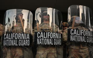 The National California Guard stands in the steps of the federal building after days of protests in response to Federal Immigration Operations in Los Angeles