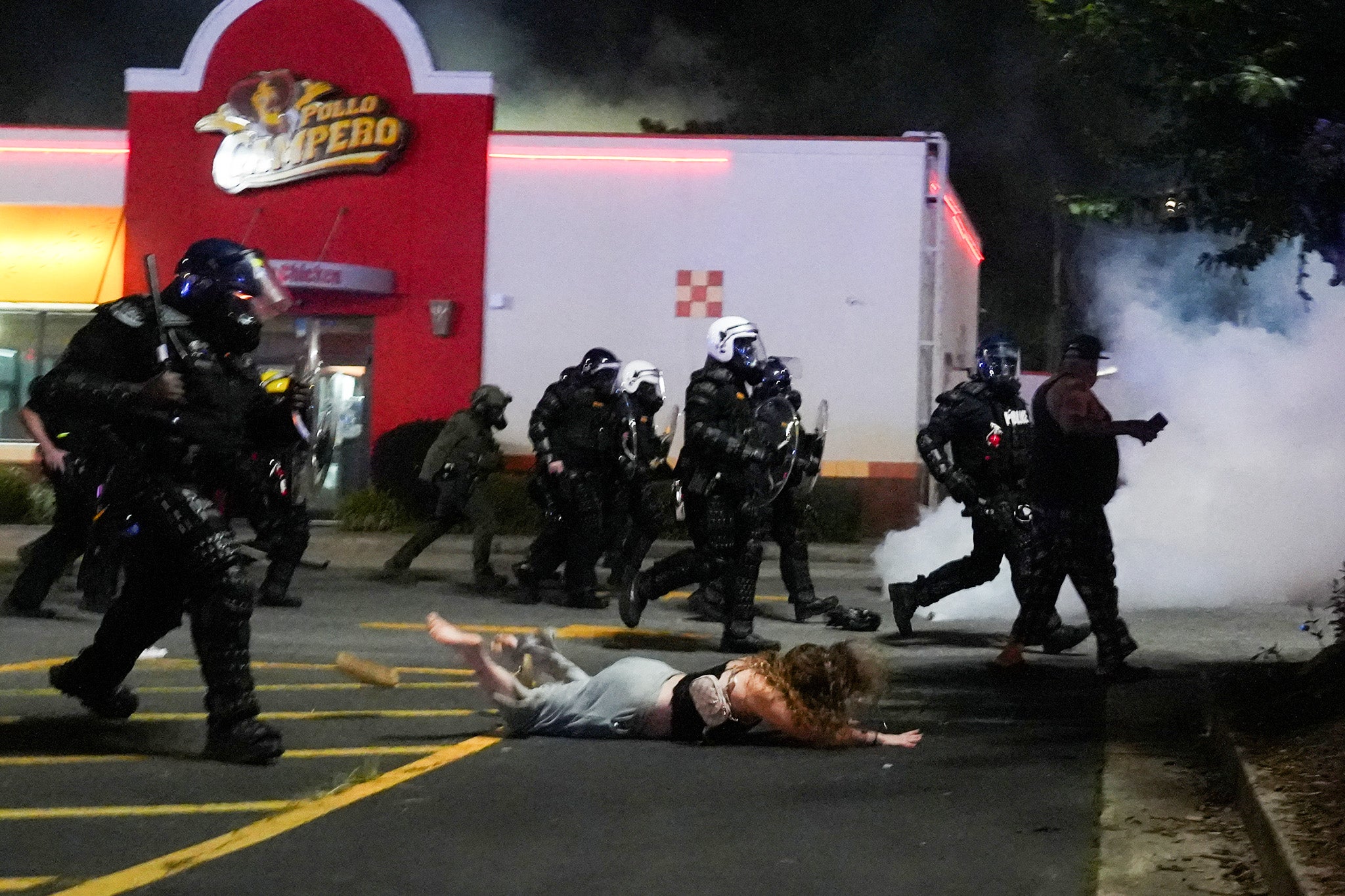 <p>Police officers try to disperse demonstrators gathered for a protest in Atlanta</p>