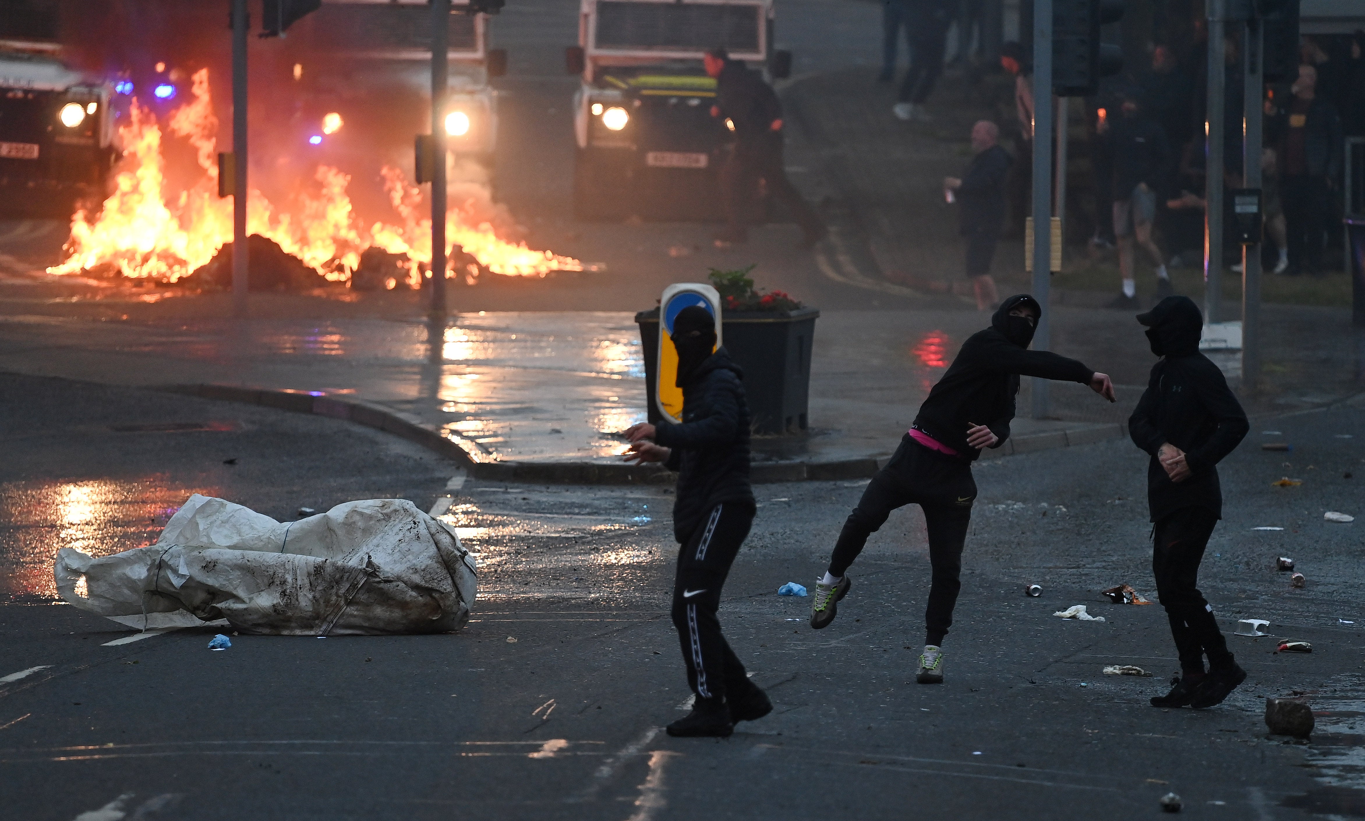 Some masked protesters abused and threw items at the police, including fireworks, glass bottles and metal pieces