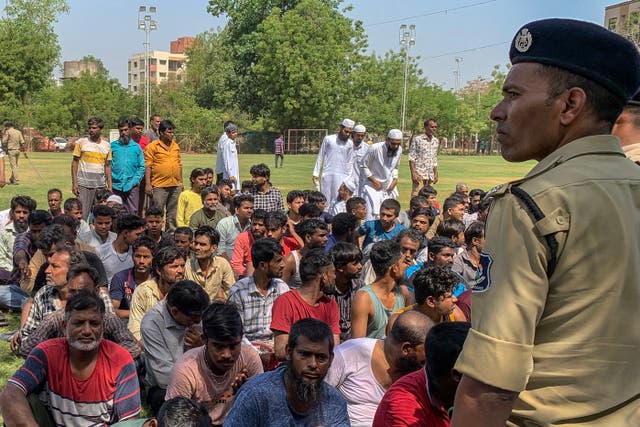 <p>Suspected Bangladeshi migrants detained by police during an overnight operation in Ahmedabad, Gujarat, on 26 April 2025</p>
