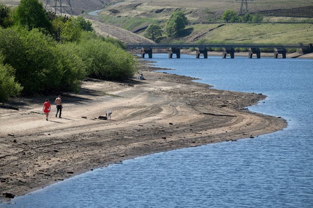 <p>The falling water level can be seen at the Baitings Reservoir, near Halifax in West Yorkshire, on 9 May 2025</p>