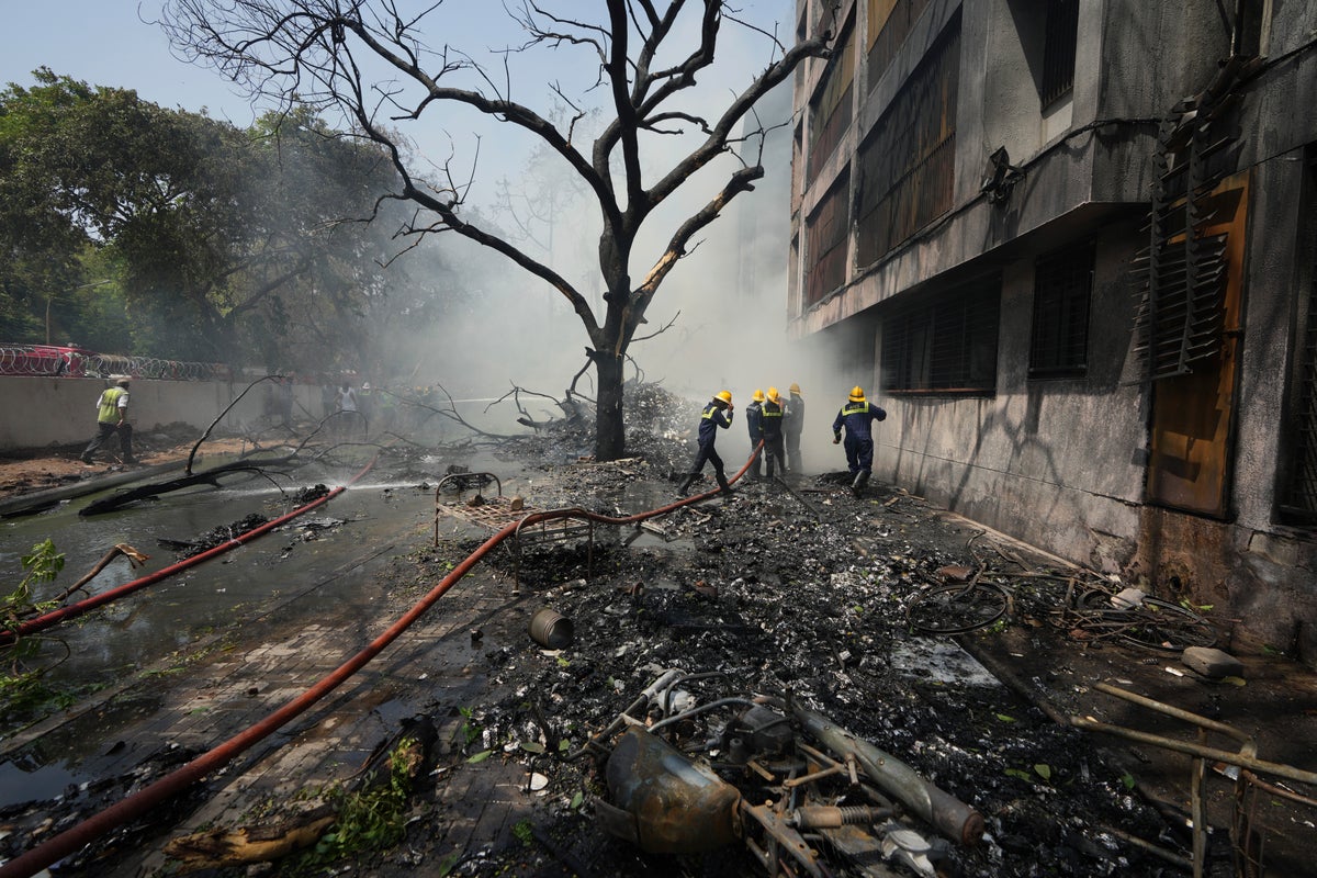 AP PHOTOS: Air India plane crashes with 242 passengers onboard