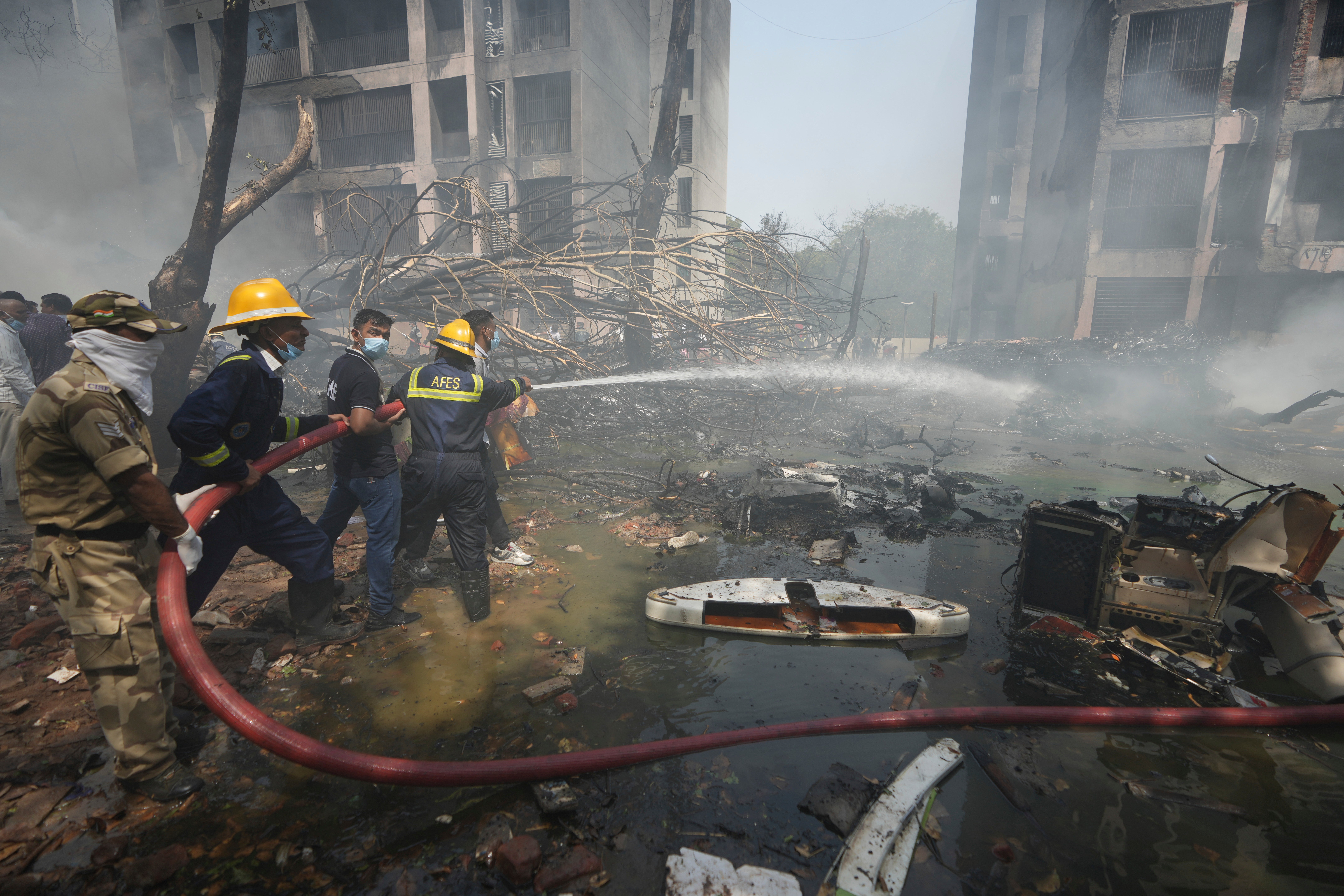 Firefighters at the scene of the fatal crash in